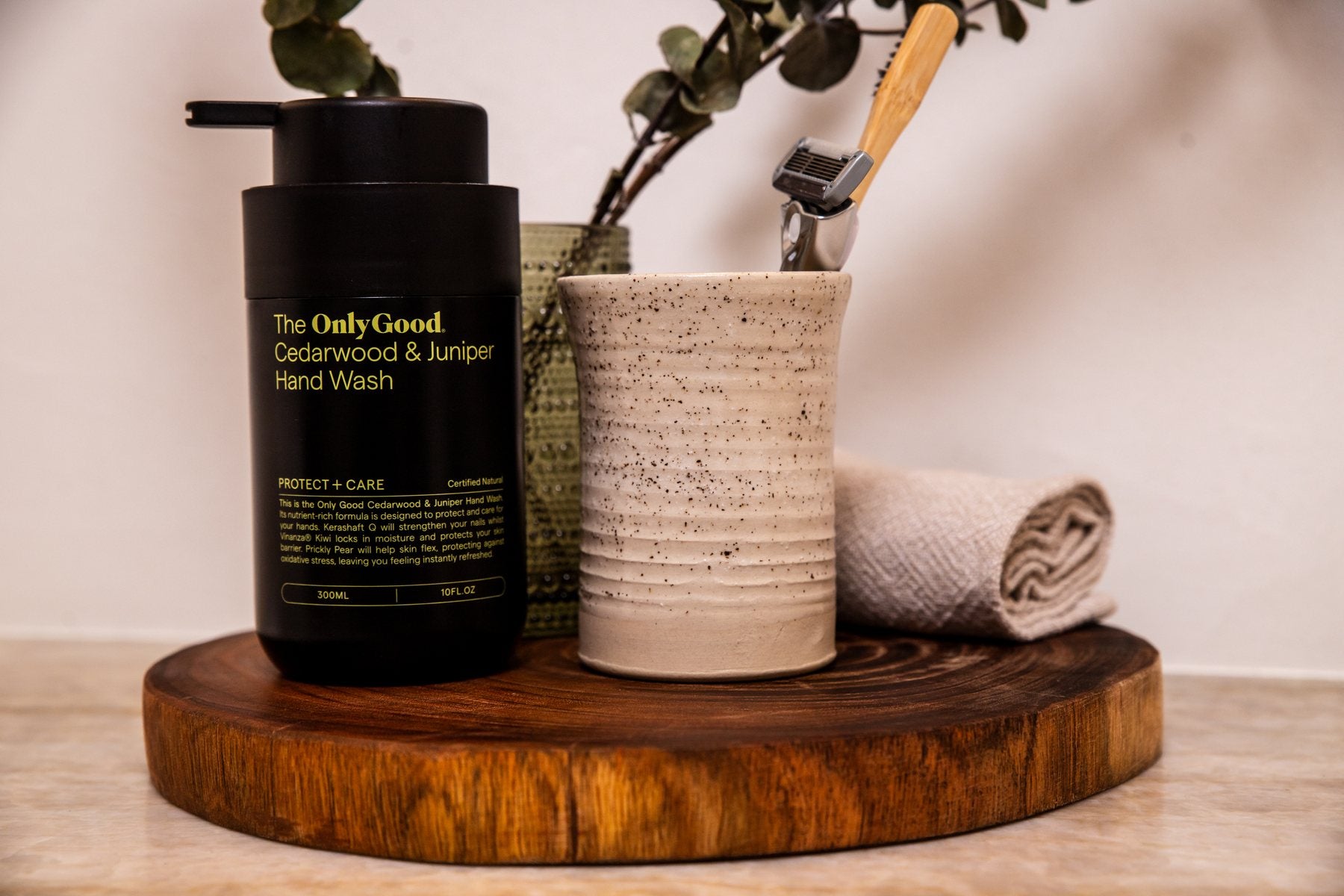 Only Good® Cedarwood & Juniper Hand Wash on a wooden tray at a bathroom vanity.